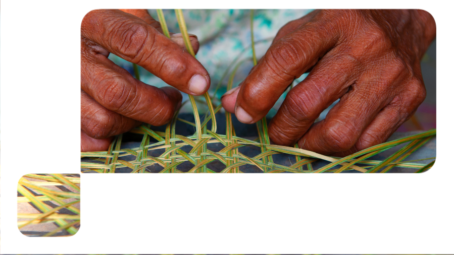 foco em mãos negras fazendo artesanato com folha de bananeira