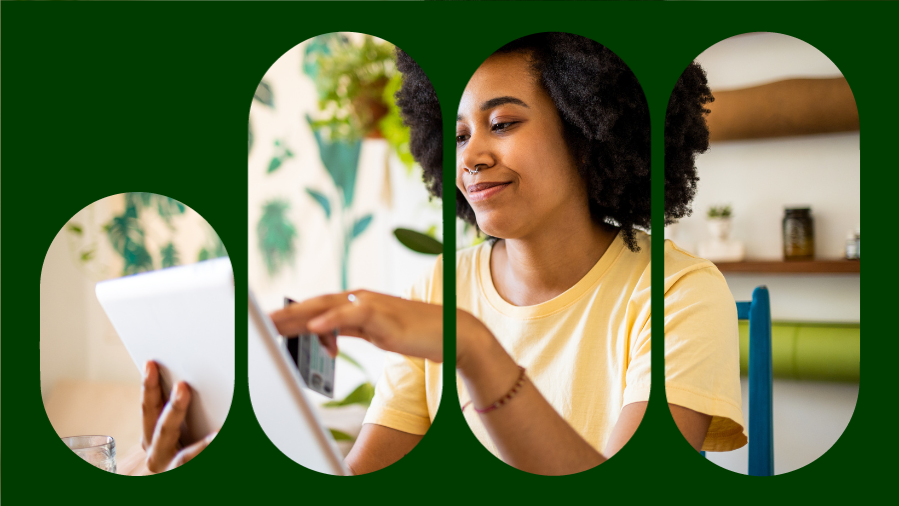 mulher com black power sorrindo digitando no tablet