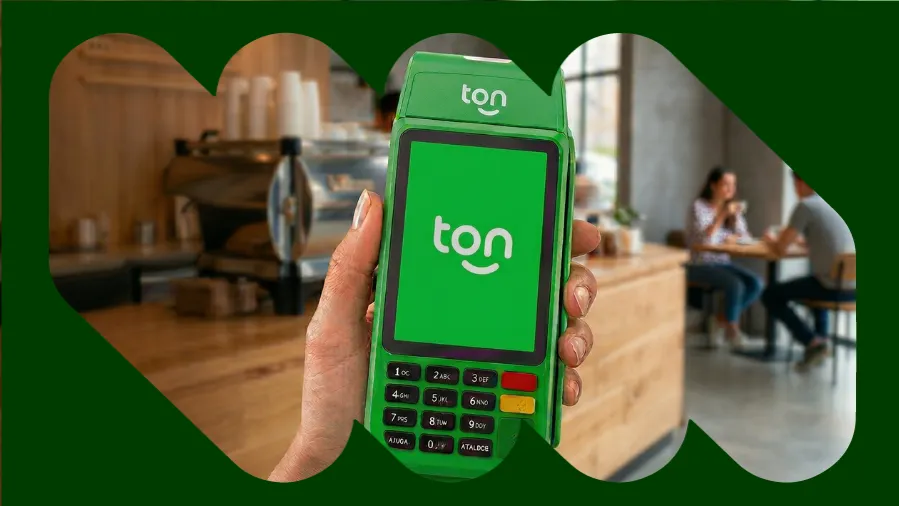 Pessoa segurando a máquina Ton